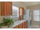 Functional laundry room with a utility sink, storage cabinets, and a stacked washer and dryer at 10417 Sutherby Dr, Charlotte, NC 28277