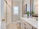 Bright bathroom with a glass-enclosed shower, white vanity, and framed mirror at 105 Plantation Ct, Shelby, NC 28150