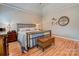 Cozy bedroom featuring a metal bed frame, hardwood floors, and neutral décor for a relaxing atmosphere at 105 Plantation Ct, Shelby, NC 28150