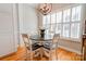 Cozy dining area with hardwood floors, natural light, and modern chandelier fixture at 105 Plantation Ct, Shelby, NC 28150