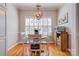 Cozy dining area with hardwood floors, and a modern light fixture, with a large window at 105 Plantation Ct, Shelby, NC 28150