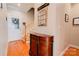 Inviting foyer with hardwood floors, a wooden accent table, and a decorative front door at 105 Plantation Ct, Shelby, NC 28150