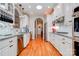 Bright kitchen features white cabinets, stainless steel appliances, and granite countertops at 105 Plantation Ct, Shelby, NC 28150