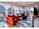 Bright sunroom with tile flooring, comfortable chairs, and large windows offering scenic views at 105 Plantation Ct, Shelby, NC 28150