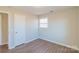 Spacious bedroom with hardwood floors and a window at 1127 Ansonville Rd, Wingate, NC 28174