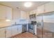 Modern kitchen with white cabinets, stainless steel appliances and granite countertops at 1127 Ansonville Rd, Wingate, NC 28174