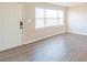 Living room featuring hardwood floors and a view of the front door at 1127 Ansonville Rd, Wingate, NC 28174