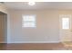 Bright living room with neutral walls and wood-look floors at 1127 Ansonville Rd, Wingate, NC 28174