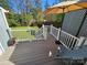 An inviting outdoor deck perfect for relaxing or entertaining, featuring deck chair and umbrella at 11433 Kingfisher Dr, Charlotte, NC 28226