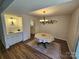 Dining room includes a wet bar and modern light fixtures at 11433 Kingfisher Dr, Charlotte, NC 28226