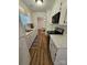 Galley kitchen with an opening into a dining area at 11433 Kingfisher Dr, Charlotte, NC 28226