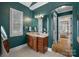 Bathroom featuring a wood vanity, green walls, and tile floors at 134 Wild Harbor Rd, Mooresville, NC 28117