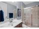 Bathroom with a vanity sink, shower with glass doors and tile surround at 134 Wild Harbor Rd, Mooresville, NC 28117