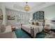 Bedroom with a chandelier, decorative wallpaper, and a large window at 134 Wild Harbor Rd, Mooresville, NC 28117