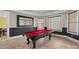 Game room with a red pool table, wainscoting, and large mirror at 134 Wild Harbor Rd, Mooresville, NC 28117