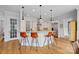 Kitchen island with barstool seating, pendant lighting, and stainless steel appliances at 134 Wild Harbor Rd, Mooresville, NC 28117