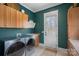 Well-equipped laundry room featuring modern washer and dryer, ample cabinetry, and stylish design at 134 Wild Harbor Rd, Mooresville, NC 28117