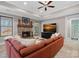 Cozy living room with a stone fireplace, tray ceilings, and comfortable seating at 134 Wild Harbor Rd, Mooresville, NC 28117