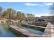 Scenic waterfront marina featuring boat slips and docks surrounded by lush trees and serene water views at 134 Wild Harbor Rd, Mooresville, NC 28117