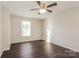 Well-lit bedroom with dark hardwood floors and a ceiling fan at 152 Oliver St, York, SC 29745