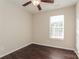 Bright bedroom with dark wood floors and window coverings at 152 Oliver St, York, SC 29745