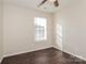 Bright bedroom with dark wood floors and window coverings at 152 Oliver St, York, SC 29745