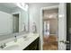 Bathroom with double sink vanity, updated lighting, and tile surround shower/tub combination at 162 Misty Woods Dr, Lake Wylie, SC 29710