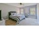 Bedroom featuring neutral walls, carpet, and a comfy bed with a desk and chair at 162 Misty Woods Dr, Lake Wylie, SC 29710