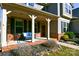 Inviting front porch with brick flooring, comfortable seating, and stylish decor at 162 Misty Woods Dr, Lake Wylie, SC 29710