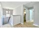 Upstairs hallway featuring carpet flooring, white walls and trim, and a charming light fixture at 162 Misty Woods Dr, Lake Wylie, SC 29710