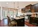 Modern kitchen featuring granite countertops, stainless steel appliances, and a breakfast bar with seating at 162 Misty Woods Dr, Lake Wylie, SC 29710