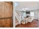 Inviting living room featuring hardwood floors, a fireplace, and an open staircase at 162 Misty Woods Dr, Lake Wylie, SC 29710