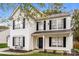 Two-story house with white siding, black shutters, and a covered front porch at 1655 Baylor Dr, Rock Hill, SC 29732