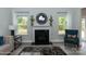 Cozy living room with a fireplace and large windows offering natural light at 170 Swann Rd, Statesville, NC 28265