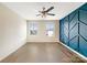 Bedroom with hardwood floors and a blue accent wall at 1721 Ameria Rd, Charlotte, NC 28215