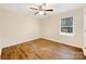 Simple bedroom with hardwood floors and window blinds at 1721 Ameria Rd, Charlotte, NC 28215