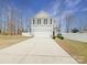 Two-story house with gray siding, a two-car garage, and a landscaped front yard at 1721 Ameria Rd, Charlotte, NC 28215