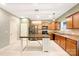 Kitchen with wooden cabinets, a kitchen island, and patterned flooring at 1721 Ameria Rd, Charlotte, NC 28215