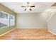 An empty living room with light green walls and wood flooring at 1721 Ameria Rd, Charlotte, NC 28215