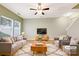 Virtually staged living room featuring gray sofas and a wooden coffee table at 1721 Ameria Rd, Charlotte, NC 28215