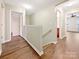 Upstairs hallway with access to bedrooms and bathroom at 1721 Ameria Rd, Charlotte, NC 28215