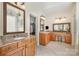 Bathroom with double sink vanity, vanity table, and walk-in closet at 1806 Grayscroft Dr, Waxhaw, NC 28173