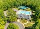 Aerial view of the community center with a pool, tennis court, and meticulously maintained landscaping at 1806 Grayscroft Dr, Waxhaw, NC 28173