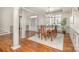 Formal dining room with hardwood floors, decorative columns, and large windows at 1806 Grayscroft Dr, Waxhaw, NC 28173