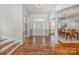 Spacious foyer featuring hardwood floors, a staircase, and a view into the dining room at 1806 Grayscroft Dr, Waxhaw, NC 28173