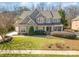 Beautiful landscaped front yard of a two-story home, showing a well-manicured lawn at 1806 Grayscroft Dr, Waxhaw, NC 28173