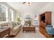 Comfortable living room with fireplace, hardwood floors, and abundant natural light at 1806 Grayscroft Dr, Waxhaw, NC 28173