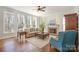 Bright living room featuring a fireplace, hardwood floors, and large windows at 1806 Grayscroft Dr, Waxhaw, NC 28173