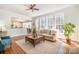 Inviting living room with hardwood floors, large windows, and comfortable seating at 1806 Grayscroft Dr, Waxhaw, NC 28173