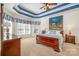 Comfortable main bedroom with large windows and a coffered ceiling at 1806 Grayscroft Dr, Waxhaw, NC 28173